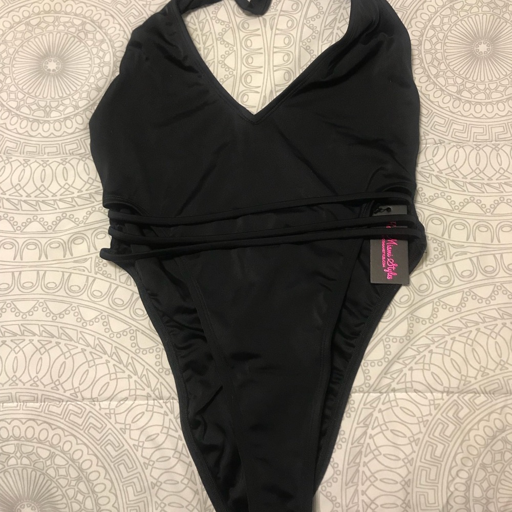 Black halter, high cut, backless one piece